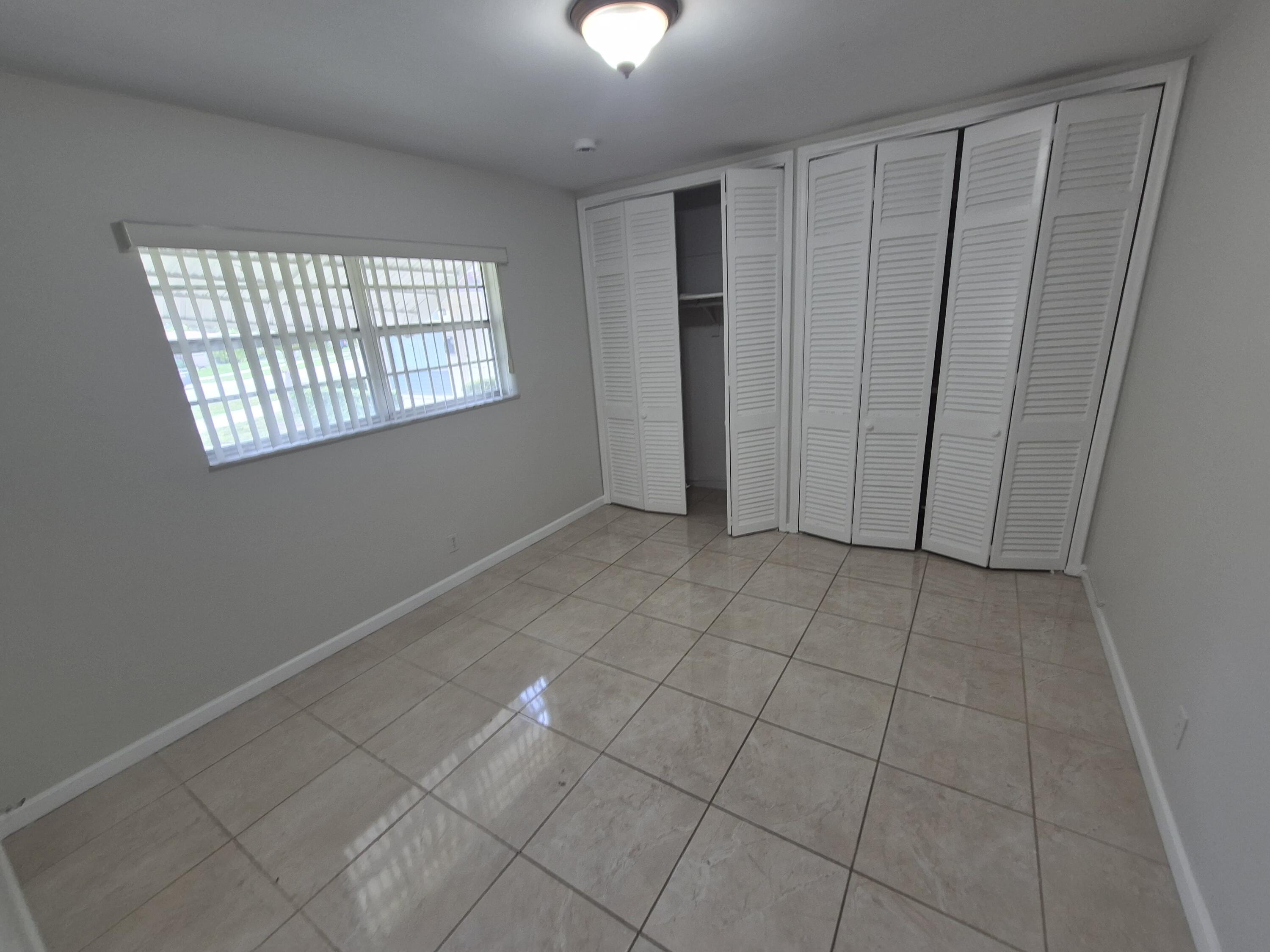 3709 Tyler Street Hollywood, FL 33021 - Photo 11 of 14 a view of an empty room with a window