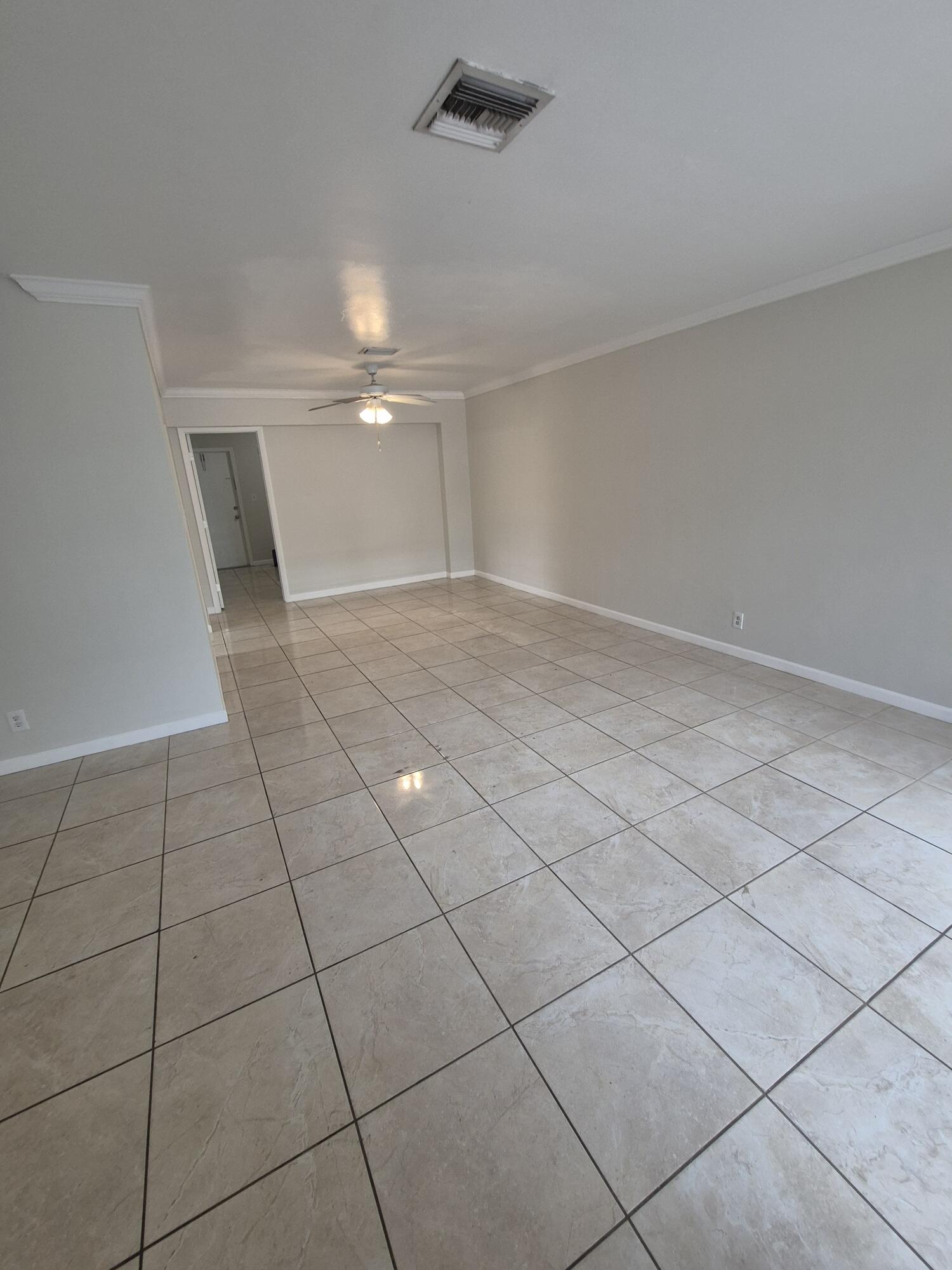 3709 Tyler Street Hollywood, FL 33021 - Photo 4 of 14 a view of an empty room and chandelier fan