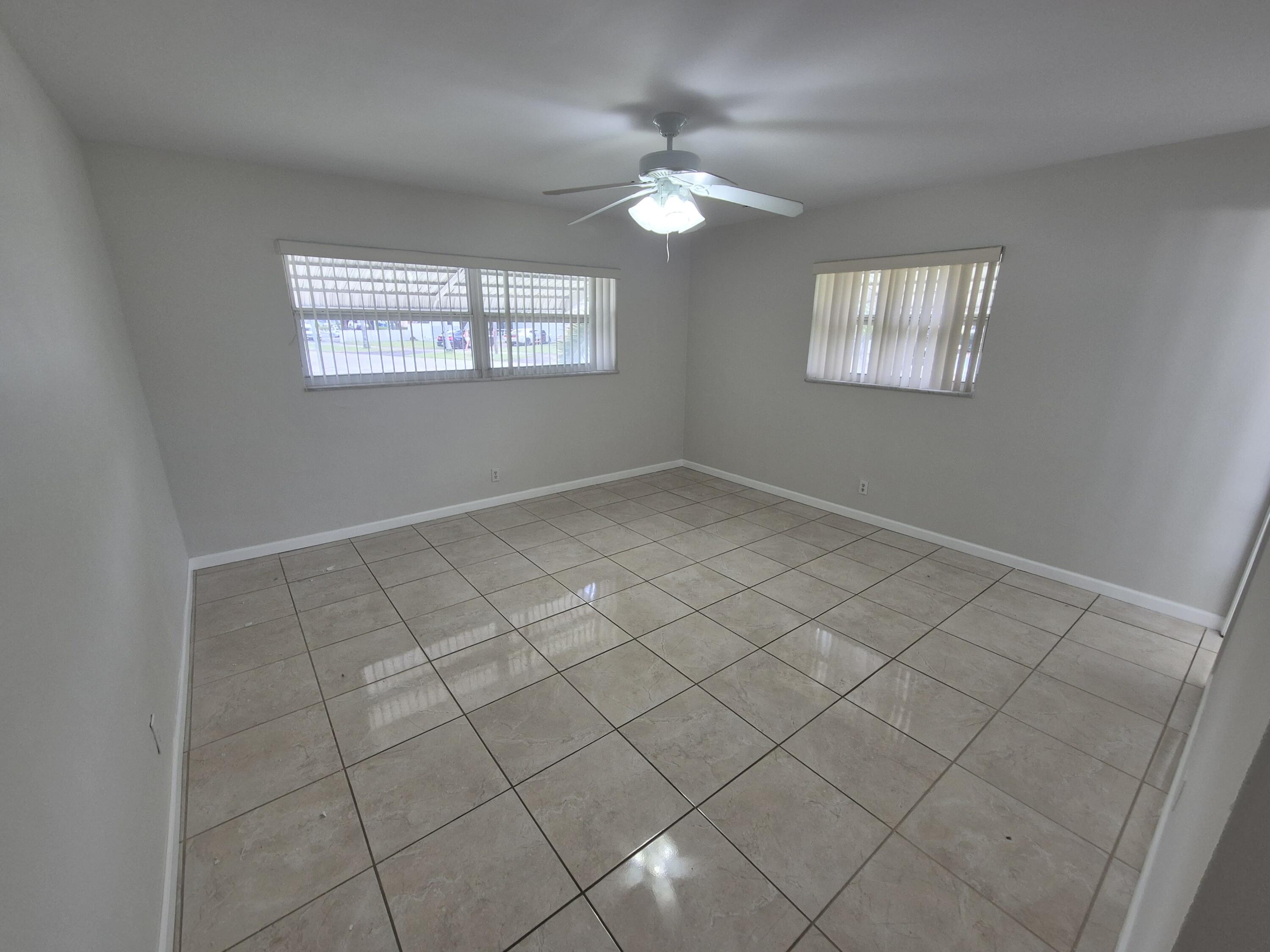 3709 Tyler Street Hollywood, FL 33021 - Photo 5 of 14 a view of an empty room and window