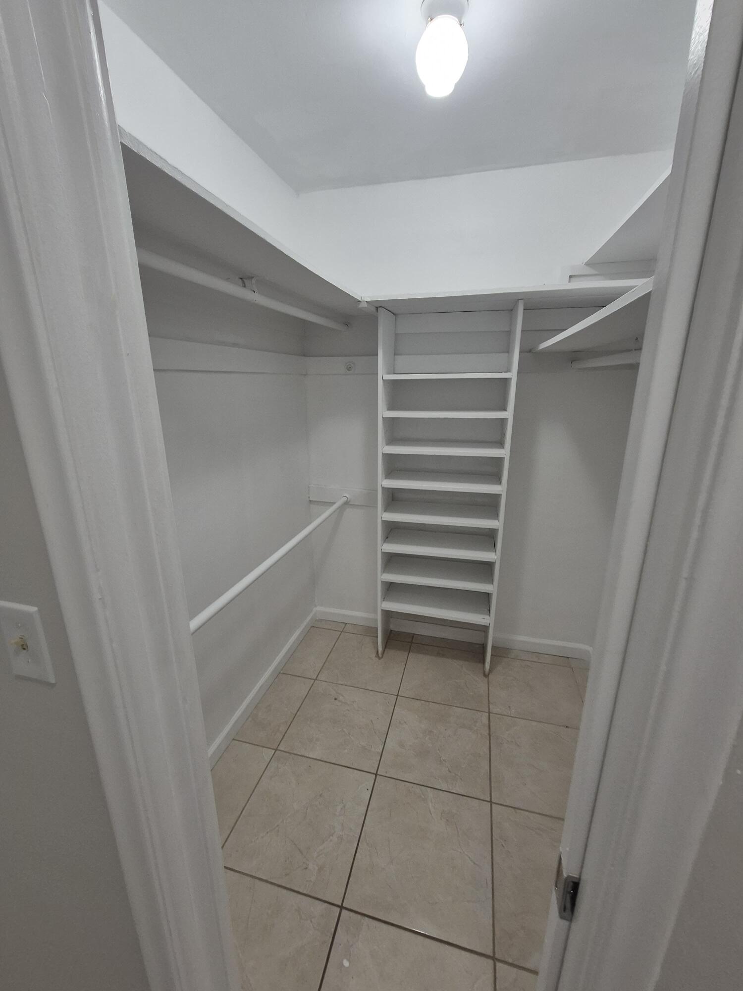 3709 Tyler Street Hollywood, FL 33021 - Photo 8 of 14 a view of walk in closet with empty racks