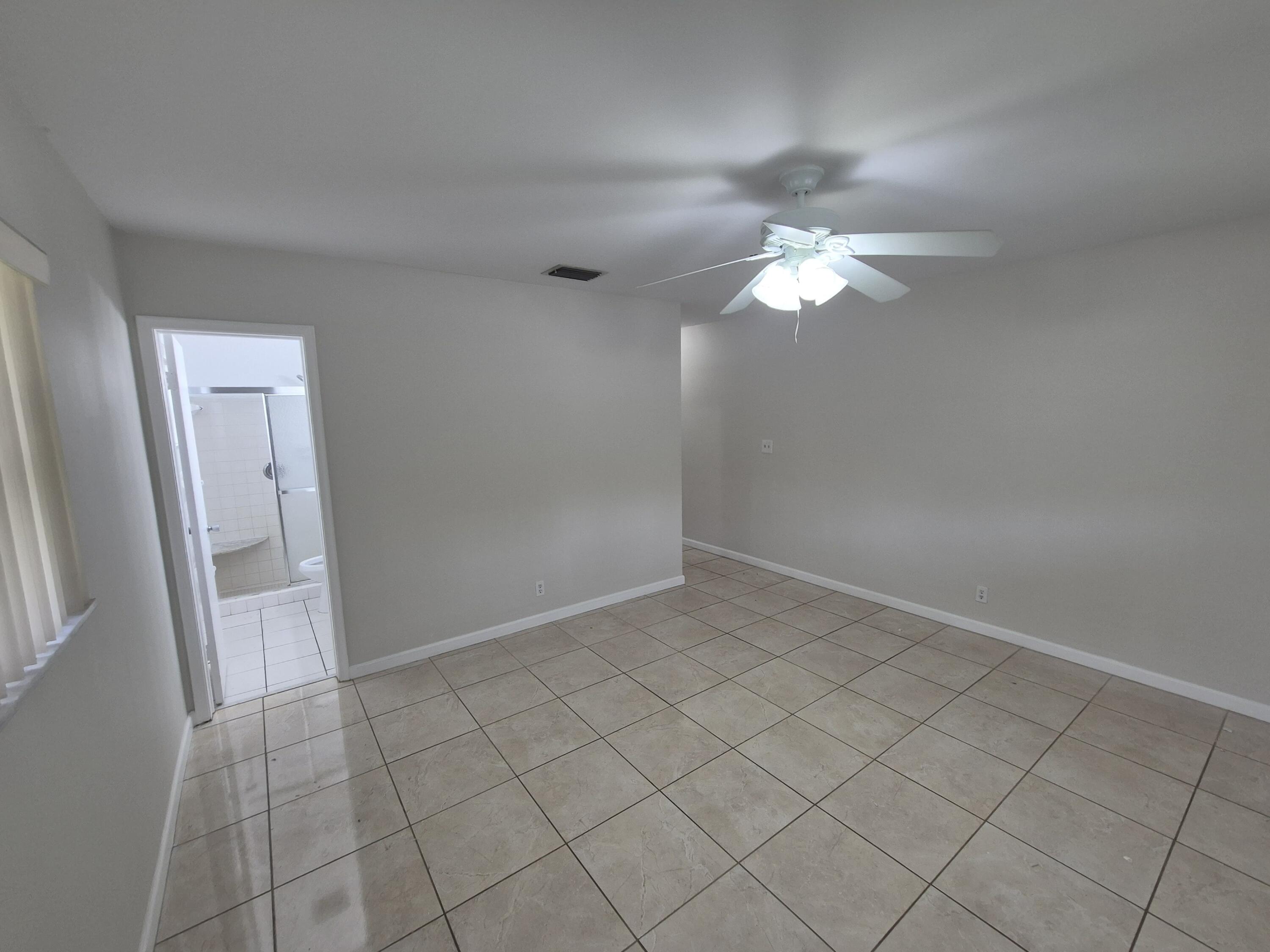 3709 Tyler Street Hollywood, FL 33021 - Photo 10 of 14 a view of a chandelier fan and closet
