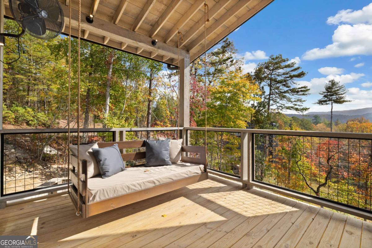 142 Sequoia Ridge Blue Ridge, GA 30513 - Photo 15 of 45 a view of a balcony with wooden floor
