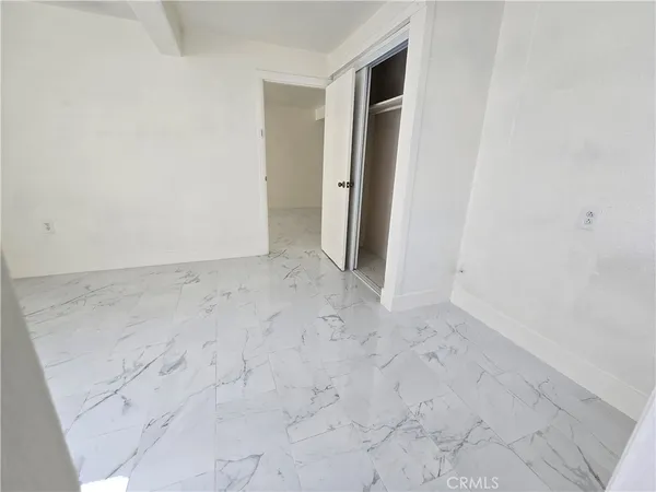 a bathroom with a granite countertop toilet a sink and a bathtub