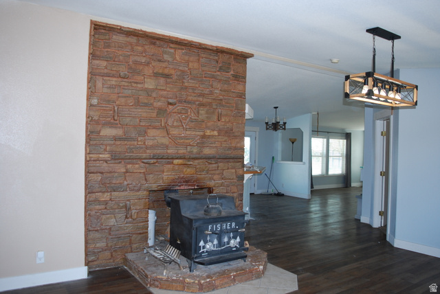 1055 West Ashby Road Delta, UT 84624 - Photo 3 of 44 Stone-clad fireplace with a wood-burning stove and hearth