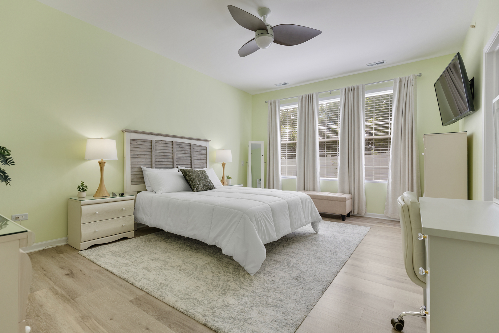 13517 Hemlock Road Huntley, IL 60142 - Photo 14 of 22 a spacious bedroom with a large bed and a flat tv screen