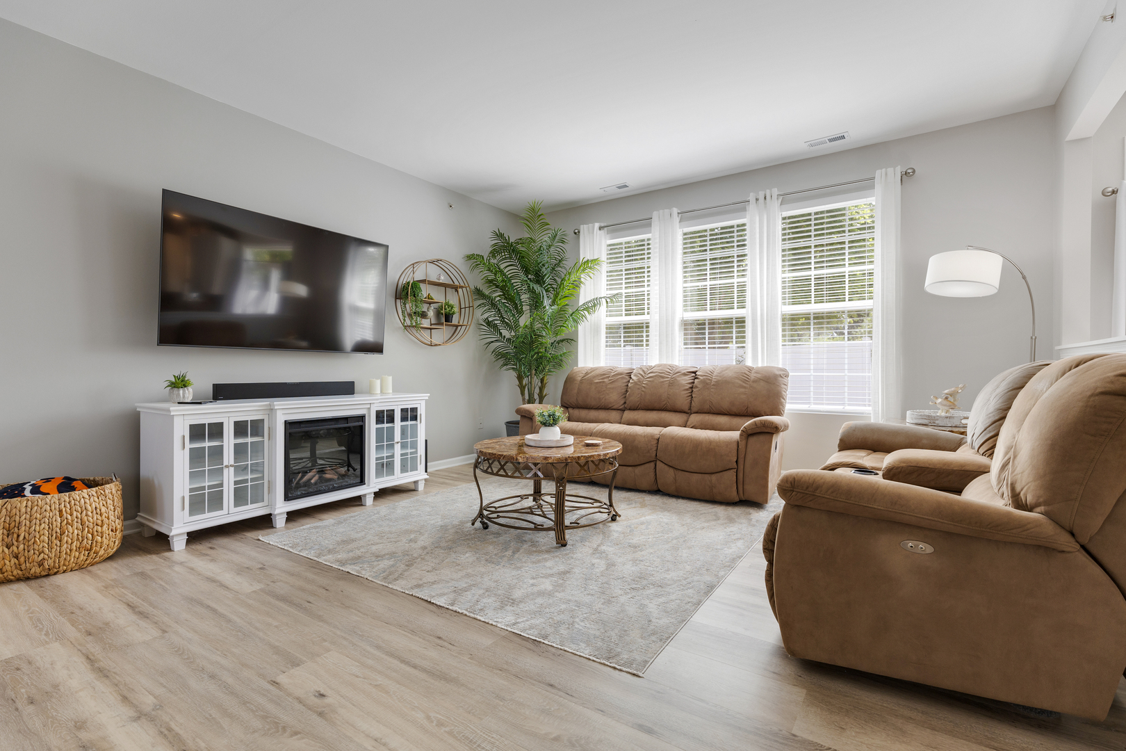 13517 Hemlock Road Huntley, IL 60142 - Photo 5 of 22 a living room with furniture a flat screen tv and a fireplace