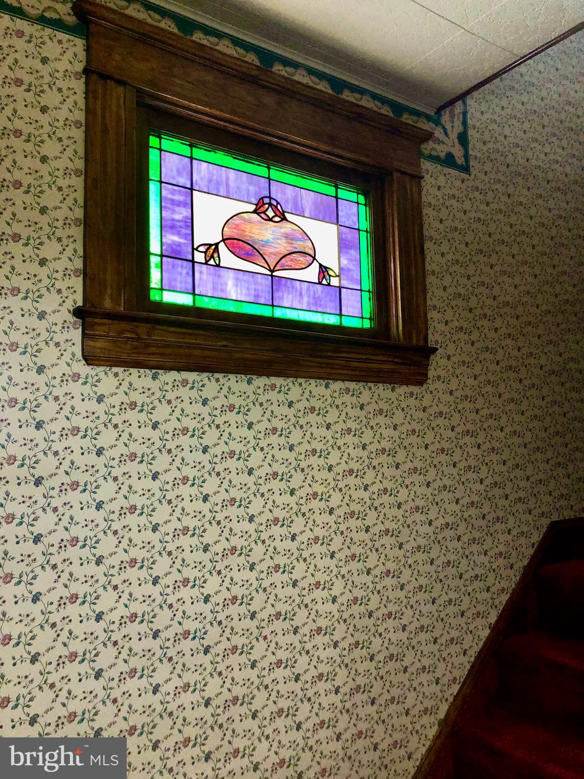 4425 Raspe Avenue Baltimore, MD 21206 - Photo 7 of 33 The beautiful stained glass window in the foyer