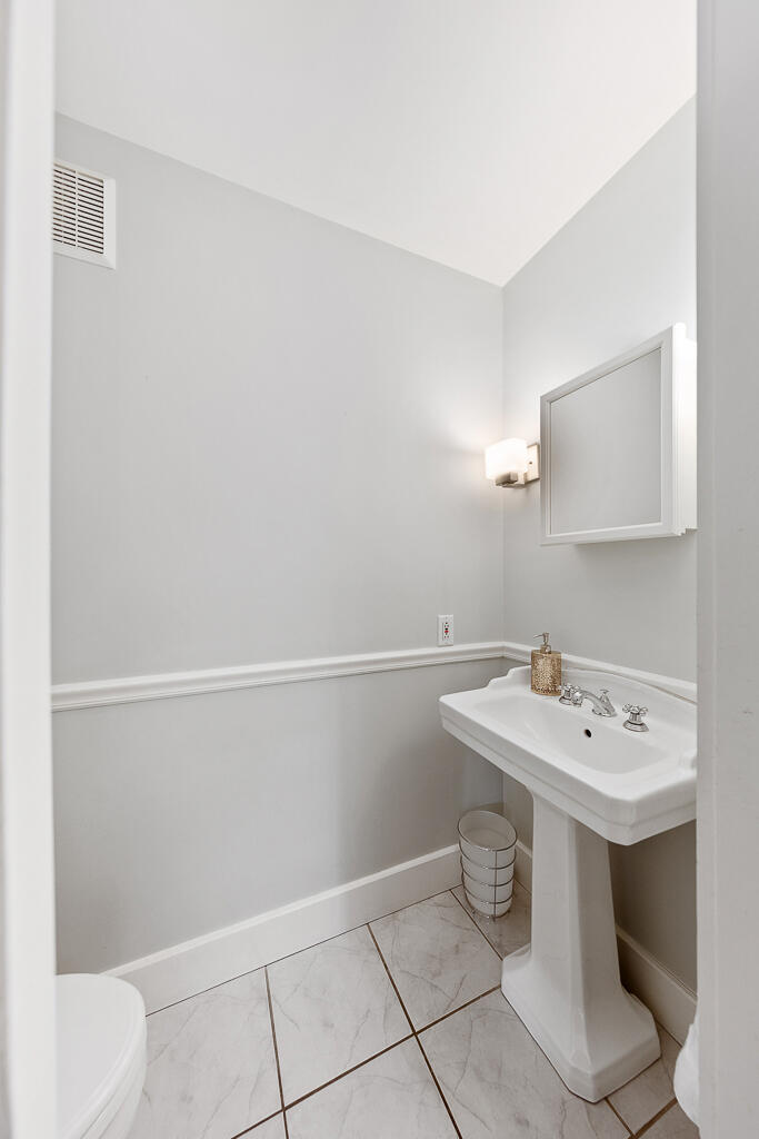 31 Brookside Road Darien, CT 06820 - Photo 11 of 34 a bathroom with a sink a toilet and vanity