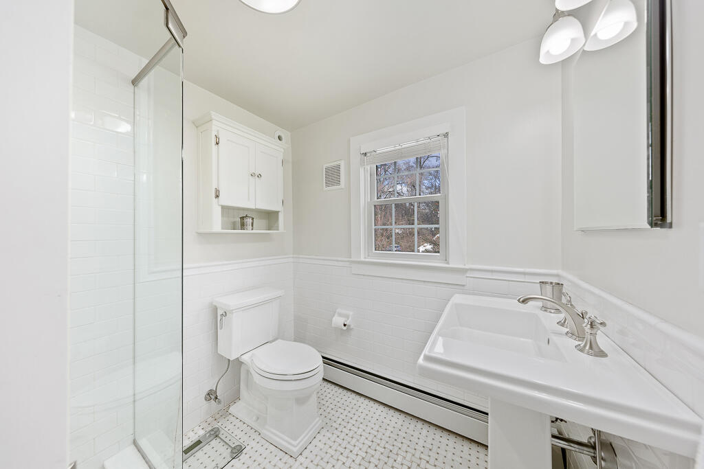 31 Brookside Road Darien, CT 06820 - Photo 18 of 34 a bathroom with a sink toilet and shower