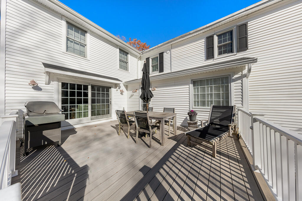 31 Brookside Road Darien, CT 06820 - Photo 25 of 34 a dinning table and chairs in patio of the house