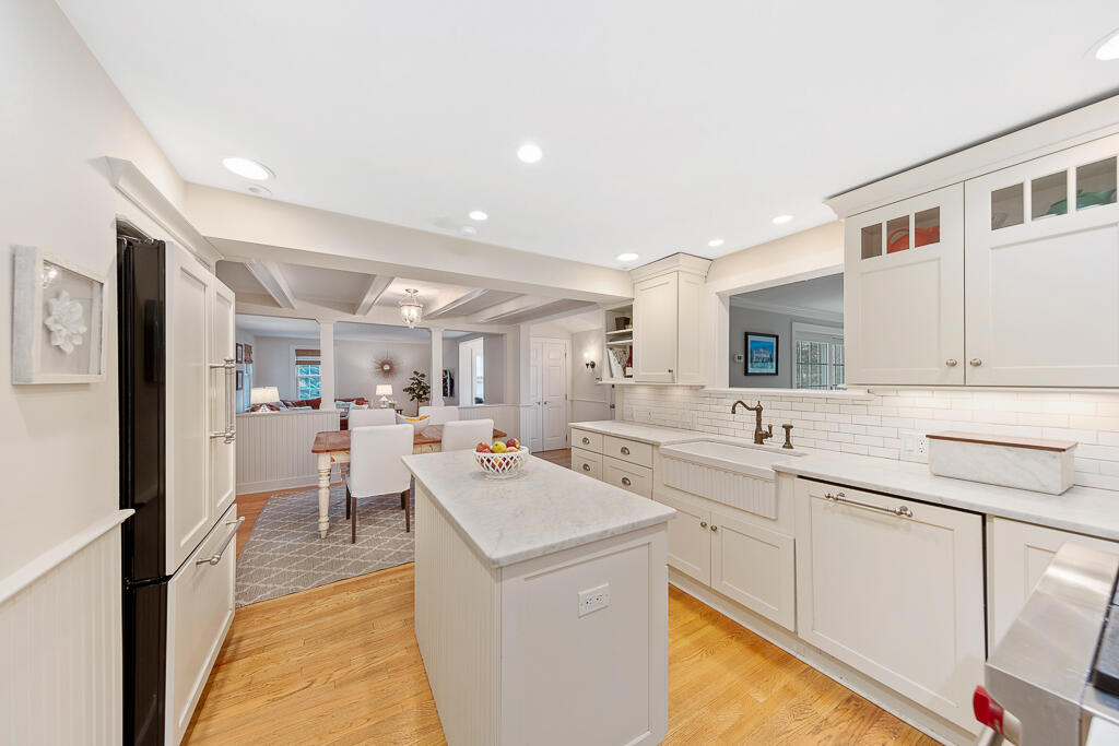 31 Brookside Road Darien, CT 06820 - Photo 9 of 34 a large white kitchen with sink and cabinets