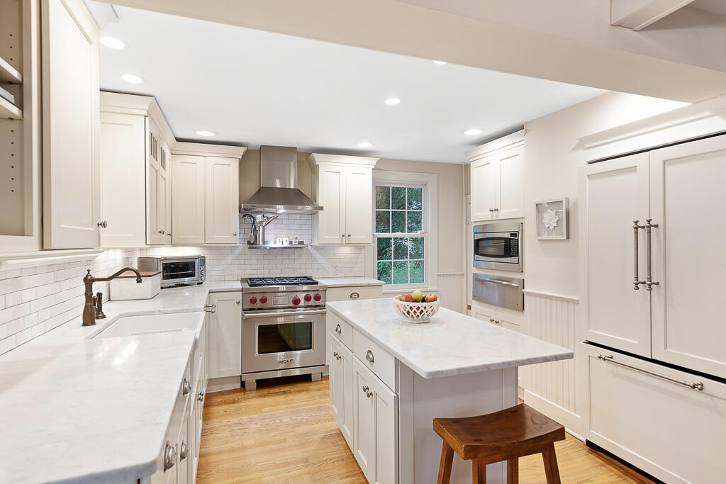 31 Brookside Road Darien, CT 06820 - Photo 10 of 34 a kitchen with a stove a sink and a refrigerator