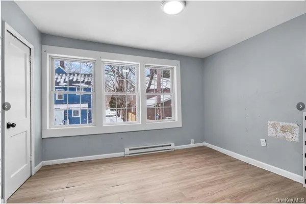 a view of an empty room with a window