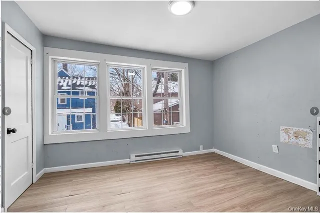 a view of an empty room with a window