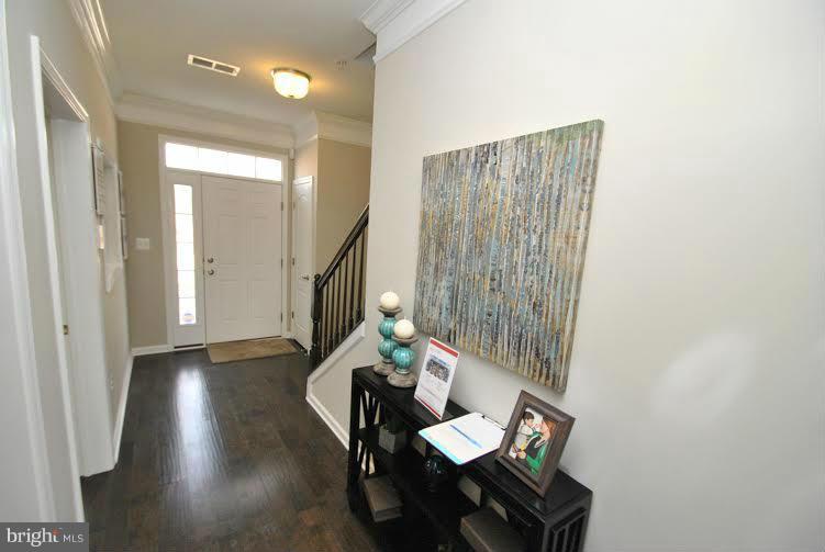 10401 Braddock Run Road Middle River, MD 21220 - Photo 4 of 19 a living room with furniture and a potted plant