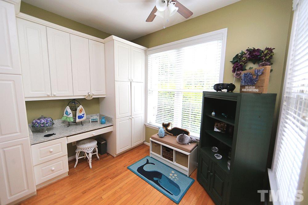 10400 Shadowlawn Drive Raleigh, NC 27614 - Photo 10 of 29 This is a breafast nook with a custom builtin desk and storage/pantry. Flows out to the deck for pond view