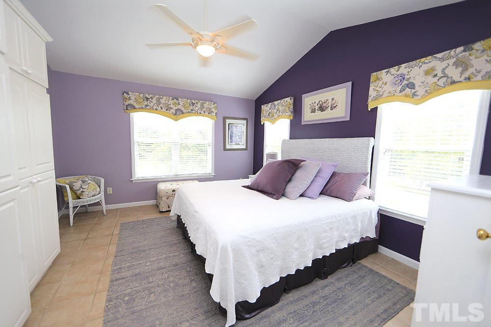 10400 Shadowlawn Drive Raleigh, NC 27614 - Photo 12 of 29 Generous size Master with custom Storage. No carpet. View to the pond and at night it is magical with the fountain and lights