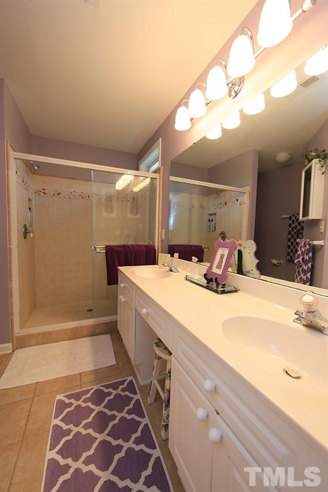 10400 Shadowlawn Drive Raleigh, NC 27614 - Photo 14 of 29 Dual sinks and walk in tiled shower.