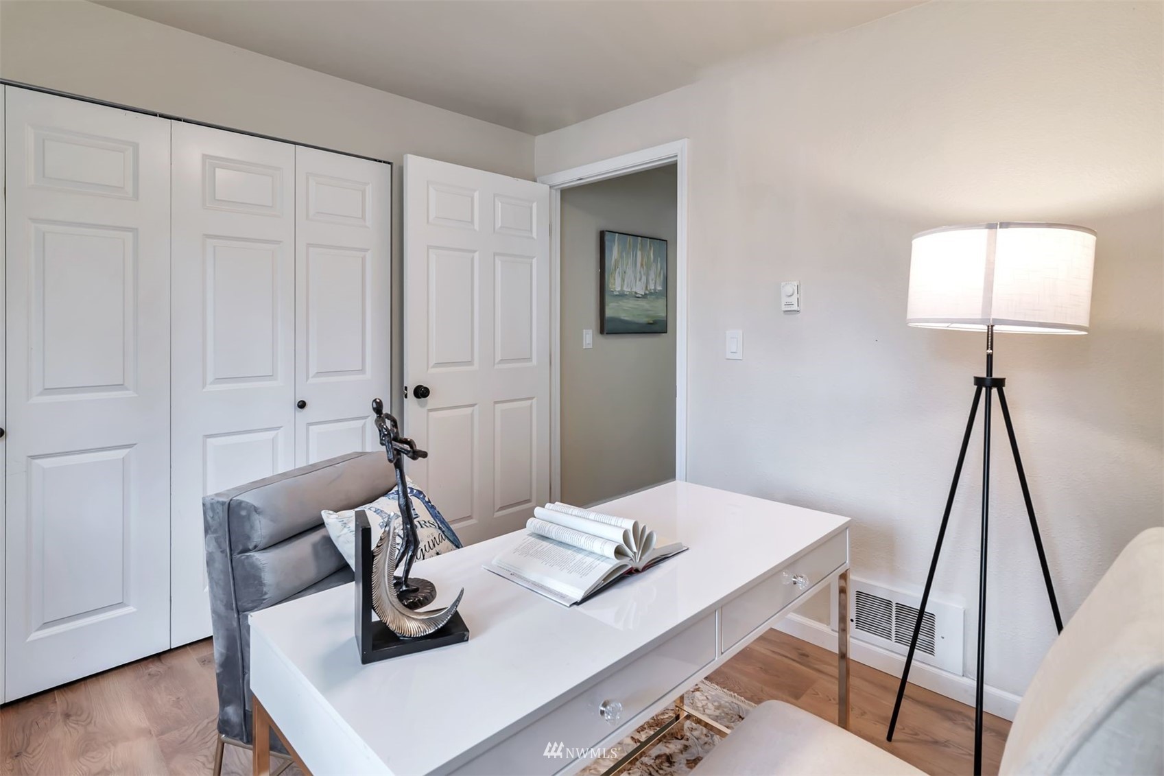 18910 Bothell Everett Highway, Unit O1 Bothell, WA 98012 - Photo 11 of 15 a view of a workspace with furniture and wooden floor