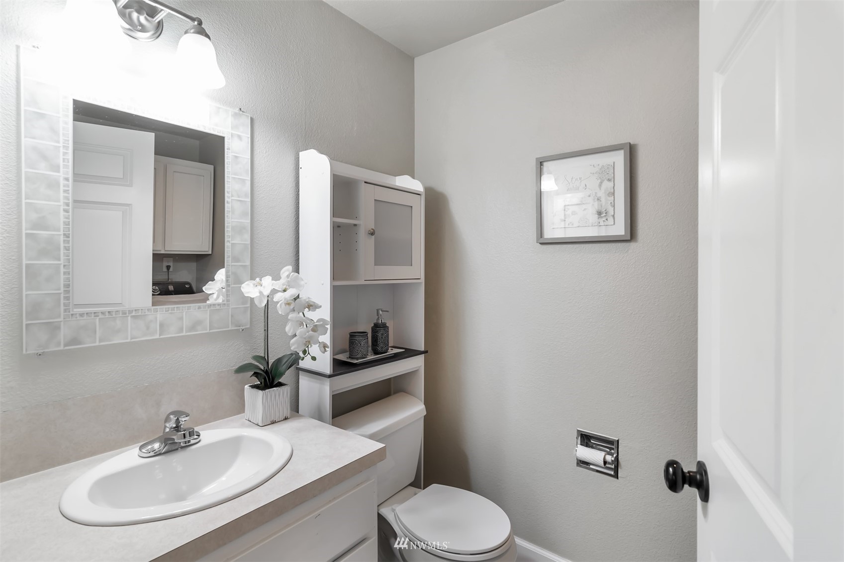 18910 Bothell Everett Highway, Unit O1 Bothell, WA 98012 - Photo 15 of 15 a bathroom with a sink toilet and mirror