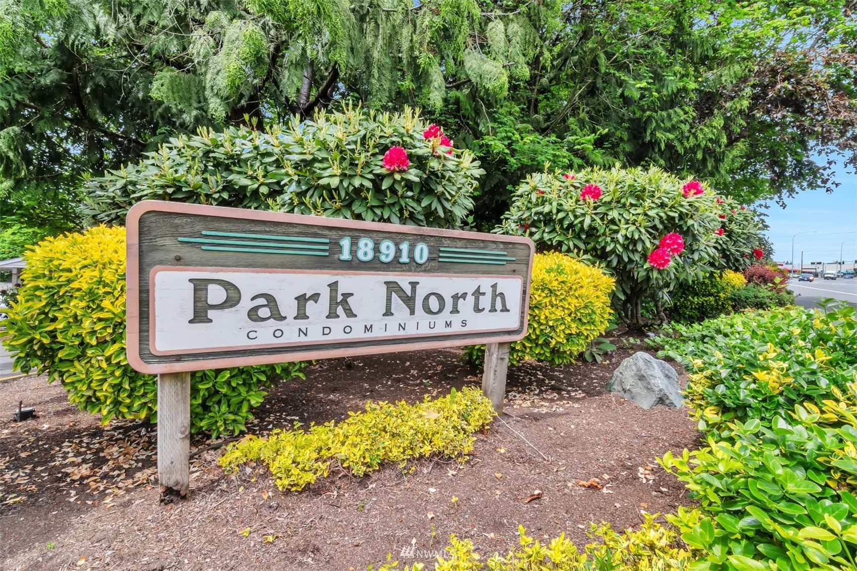 18910 Bothell Everett Highway, Unit O1 Bothell, WA 98012 - Photo 2 of 15 a sign on the side of a road