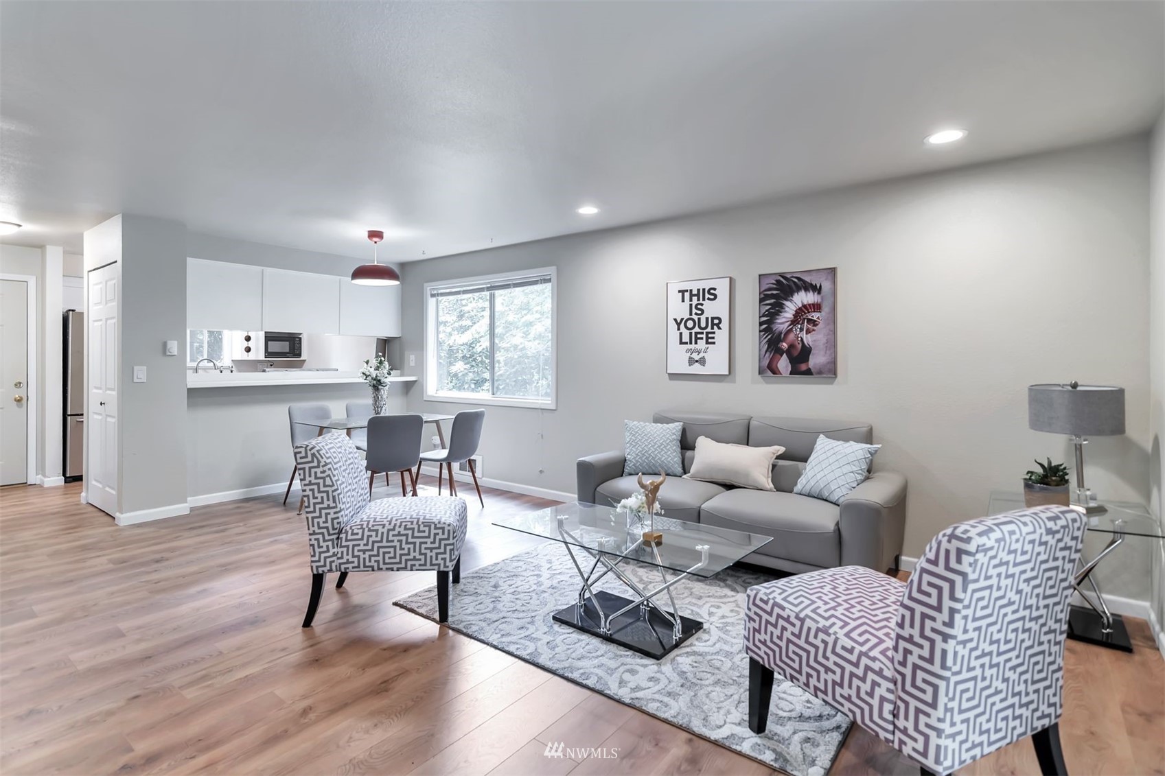 18910 Bothell Everett Highway, Unit O1 Bothell, WA 98012 - Photo 4 of 15 a living room with furniture and a window
