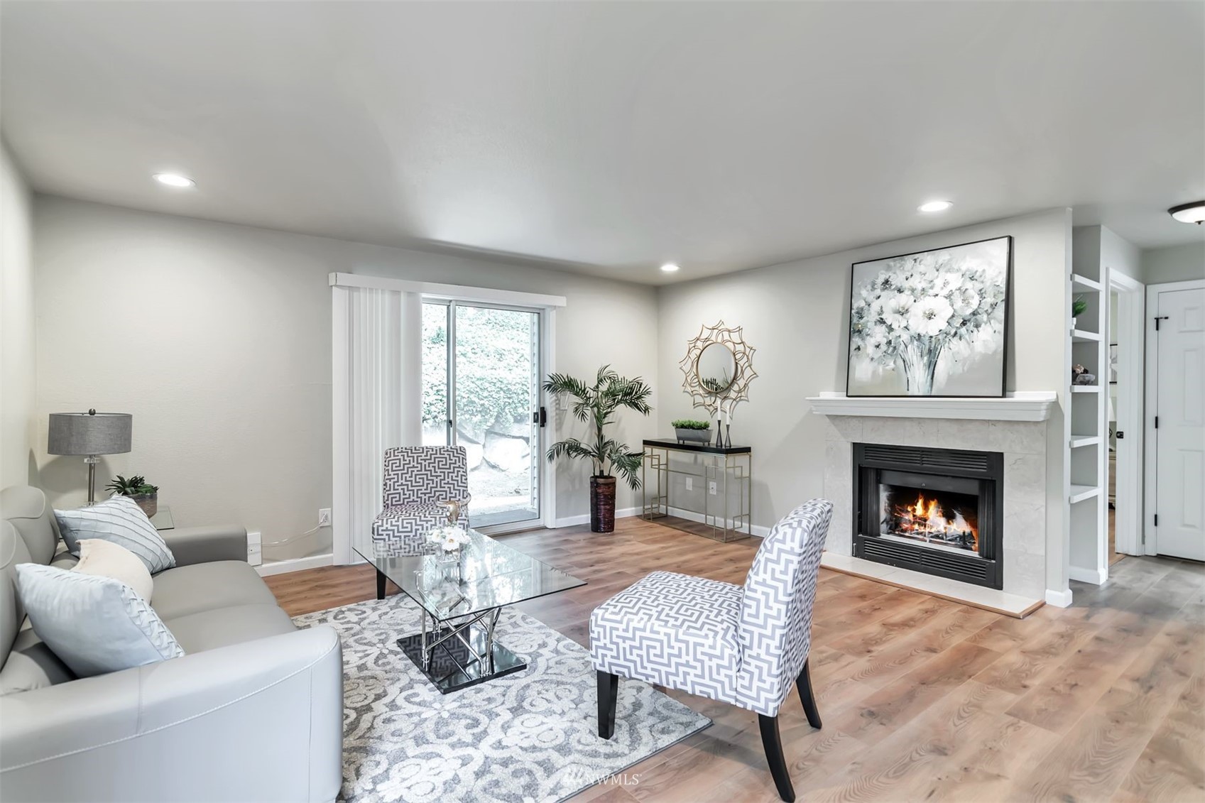 18910 Bothell Everett Highway, Unit O1 Bothell, WA 98012 - Photo 5 of 15 a living room with furniture fireplace and window