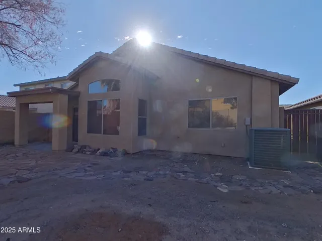 a view of a backyard of the house