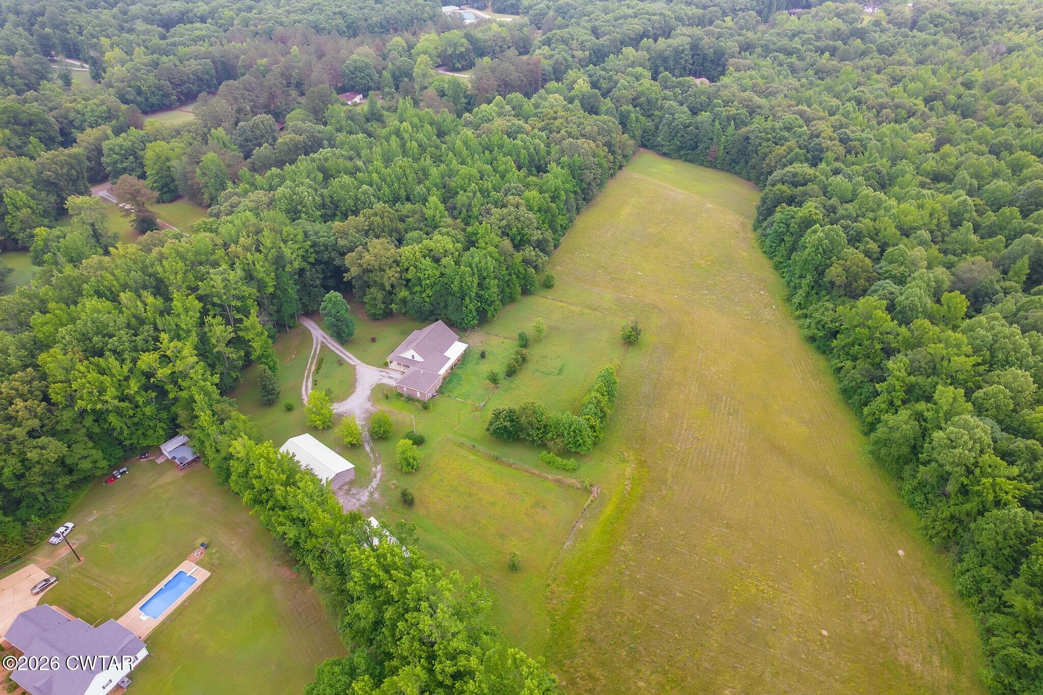 4080 Beech Bluff Road Beech Bluff, TN 38313 - Photo 10 of 41 a aerial view of a residential houses with yard