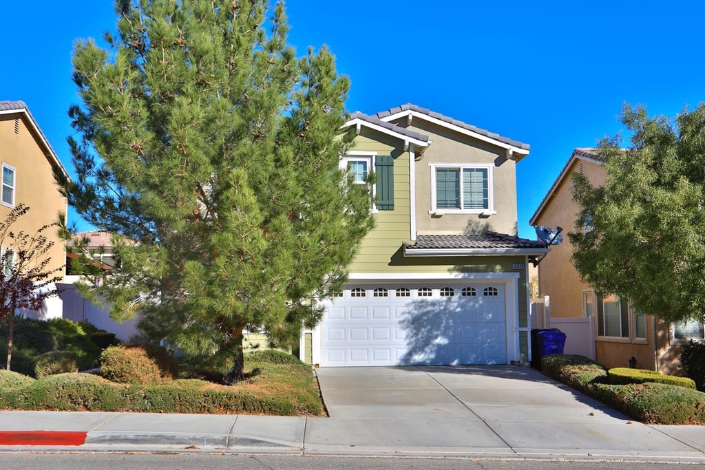 15628 Ripple Ridge Way Victorville, CA 92394 - Photo 1 of 1 a front view of a house with a yard