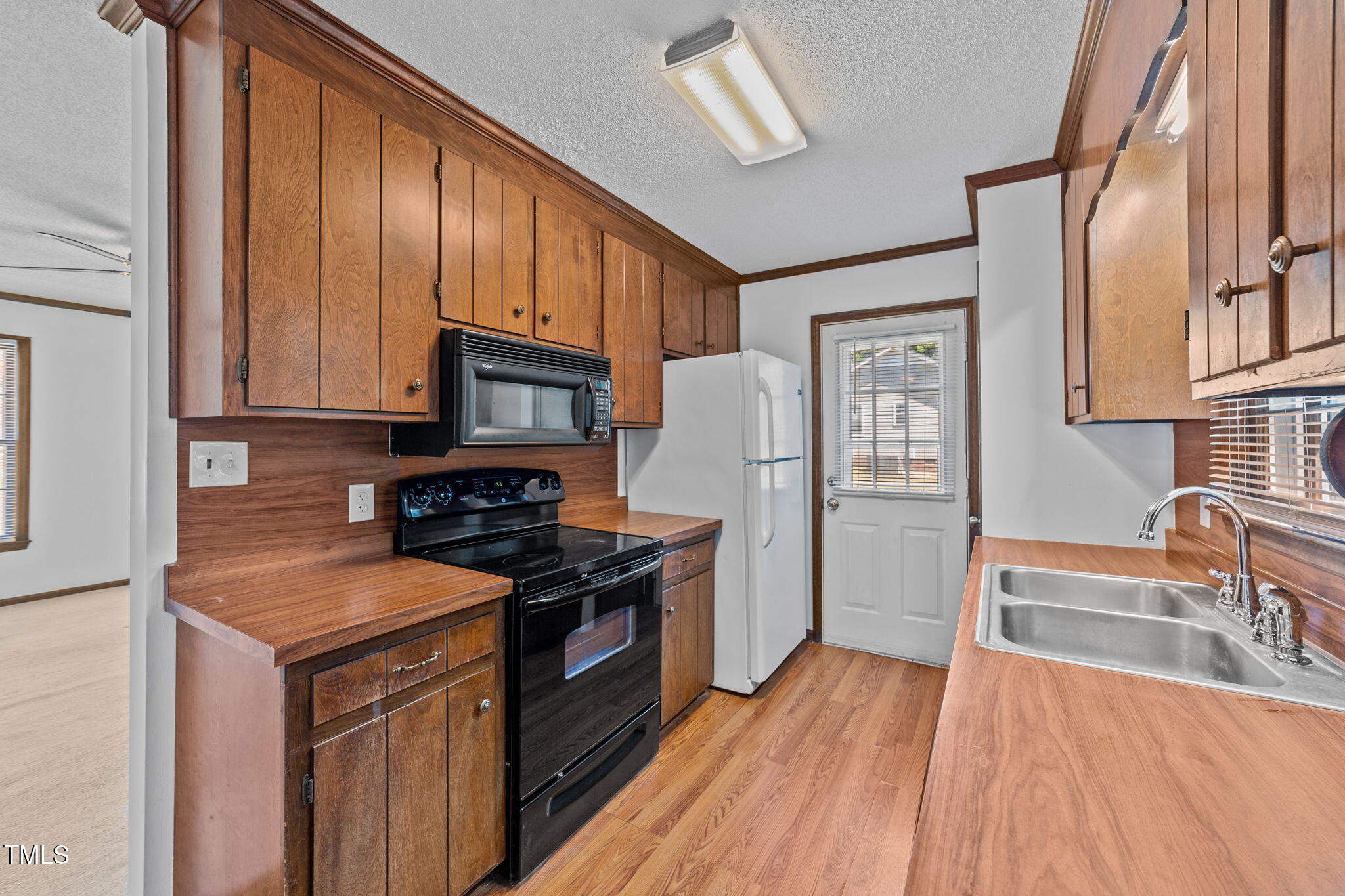 1101 Robinfield Drive Raleigh, NC 27603 - Photo 12 of 48 a kitchen with stainless steel appliances granite countertop a refrigerator stove and sink