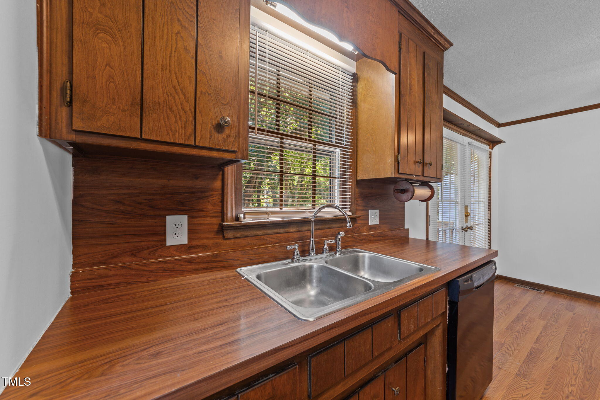 1101 Robinfield Drive Raleigh, NC 27603 - Photo 14 of 48 a kitchen with sink a window and appliances