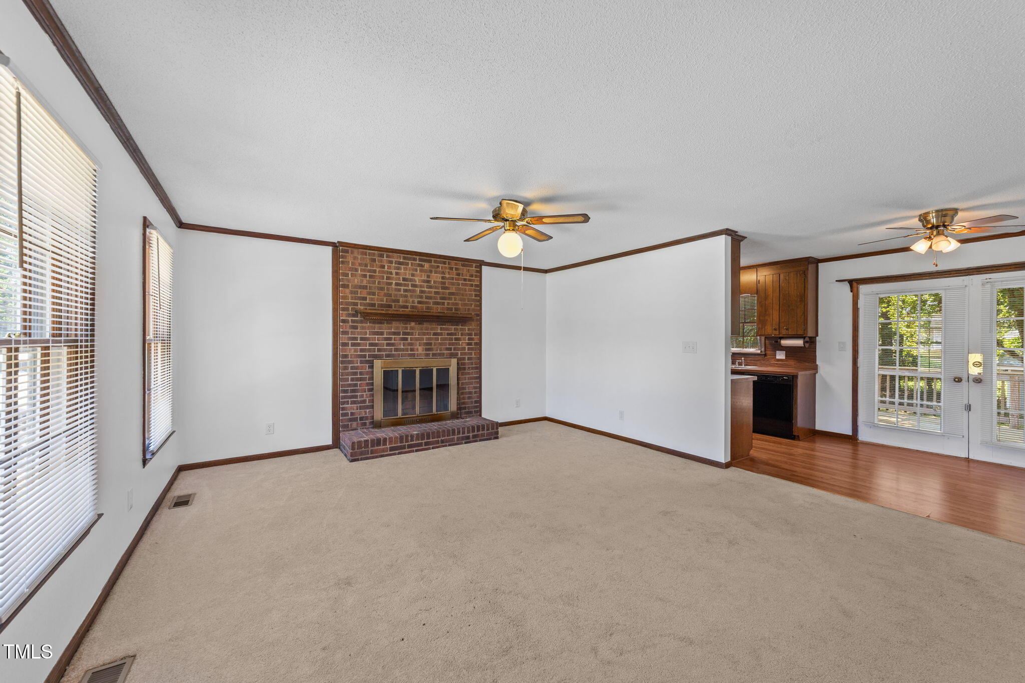 1101 Robinfield Drive Raleigh, NC 27603 - Photo 17 of 48 a view of an empty room with a window and fire place