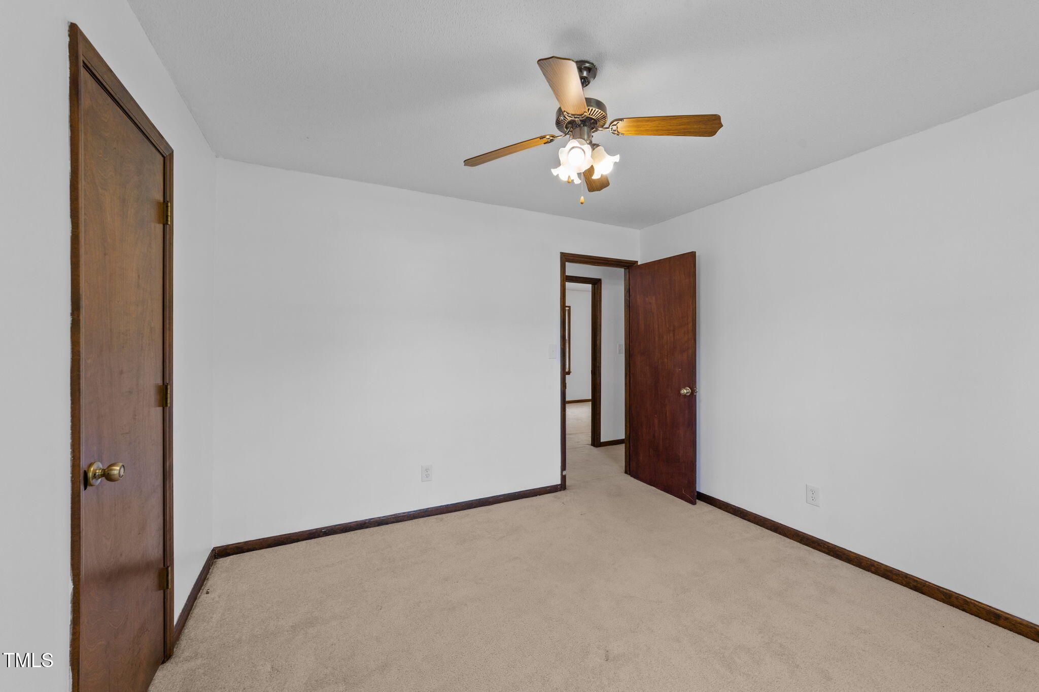 1101 Robinfield Drive Raleigh, NC 27603 - Photo 18 of 48 a view of a livingroom with a ceiling fan and window