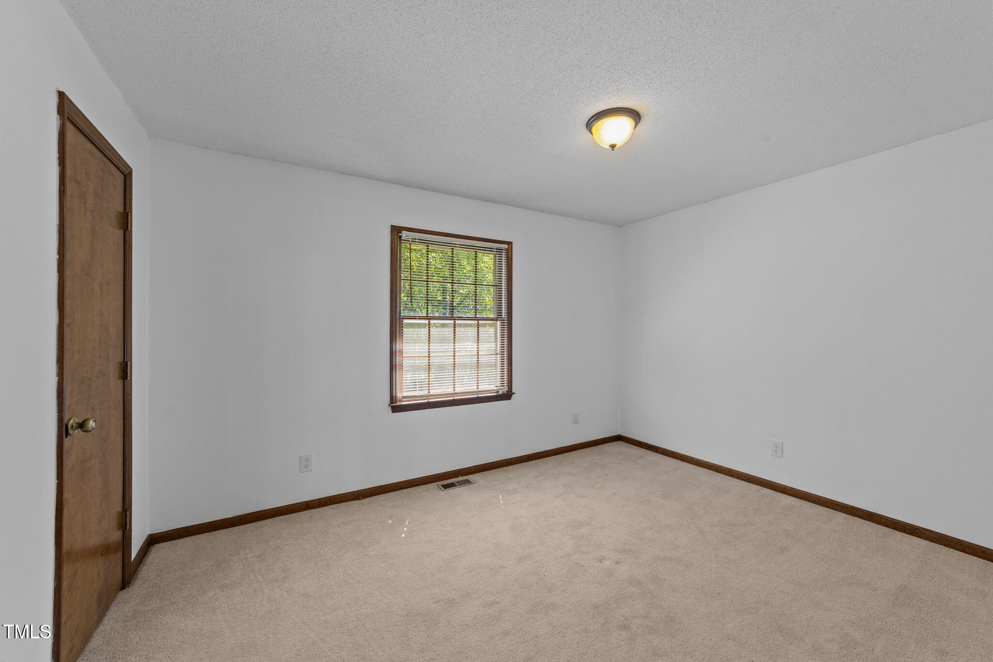 1101 Robinfield Drive Raleigh, NC 27603 - Photo 19 of 48 an empty room with windows