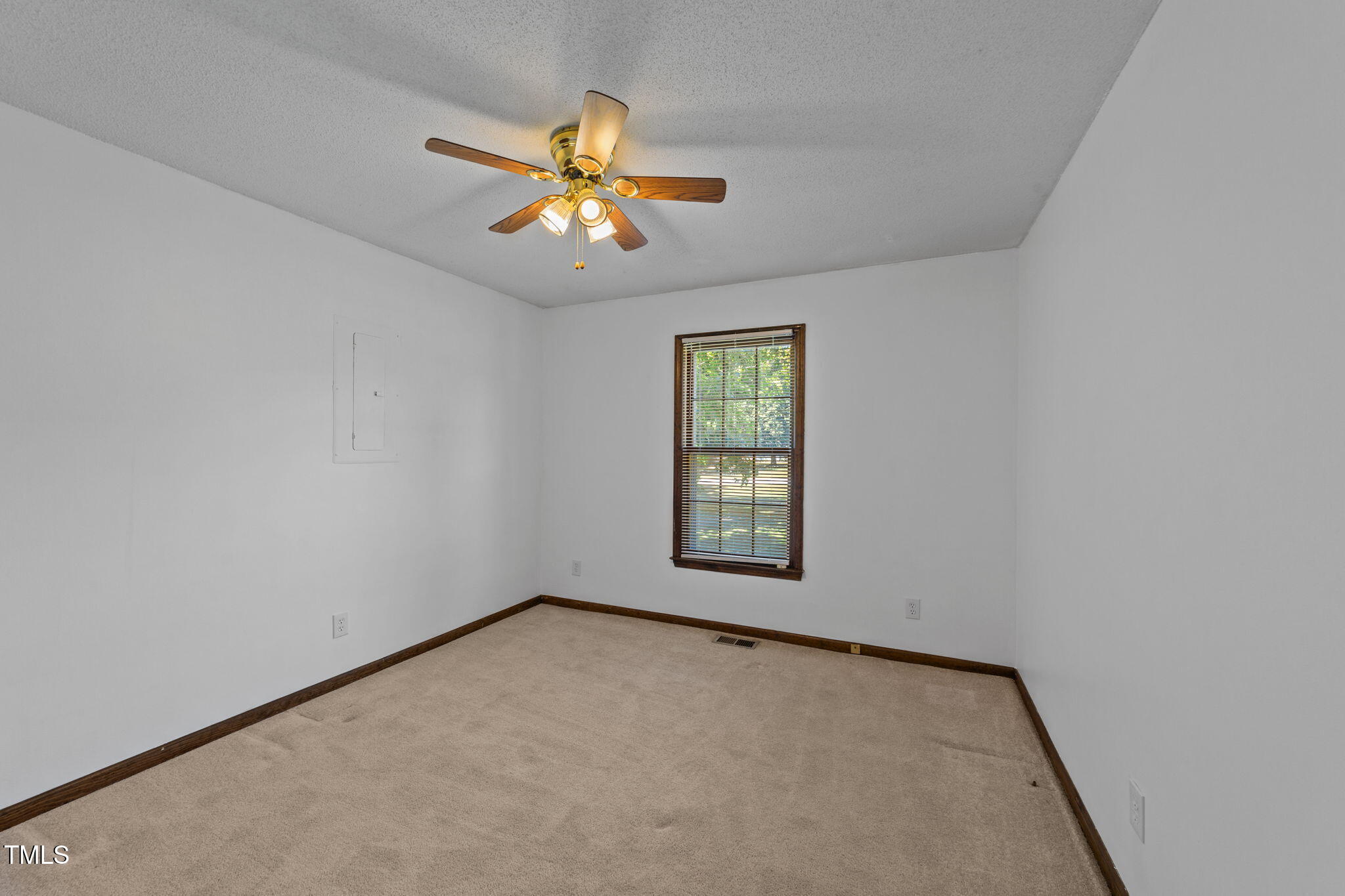 1101 Robinfield Drive Raleigh, NC 27603 - Photo 20 of 48 an empty room with windows and fan