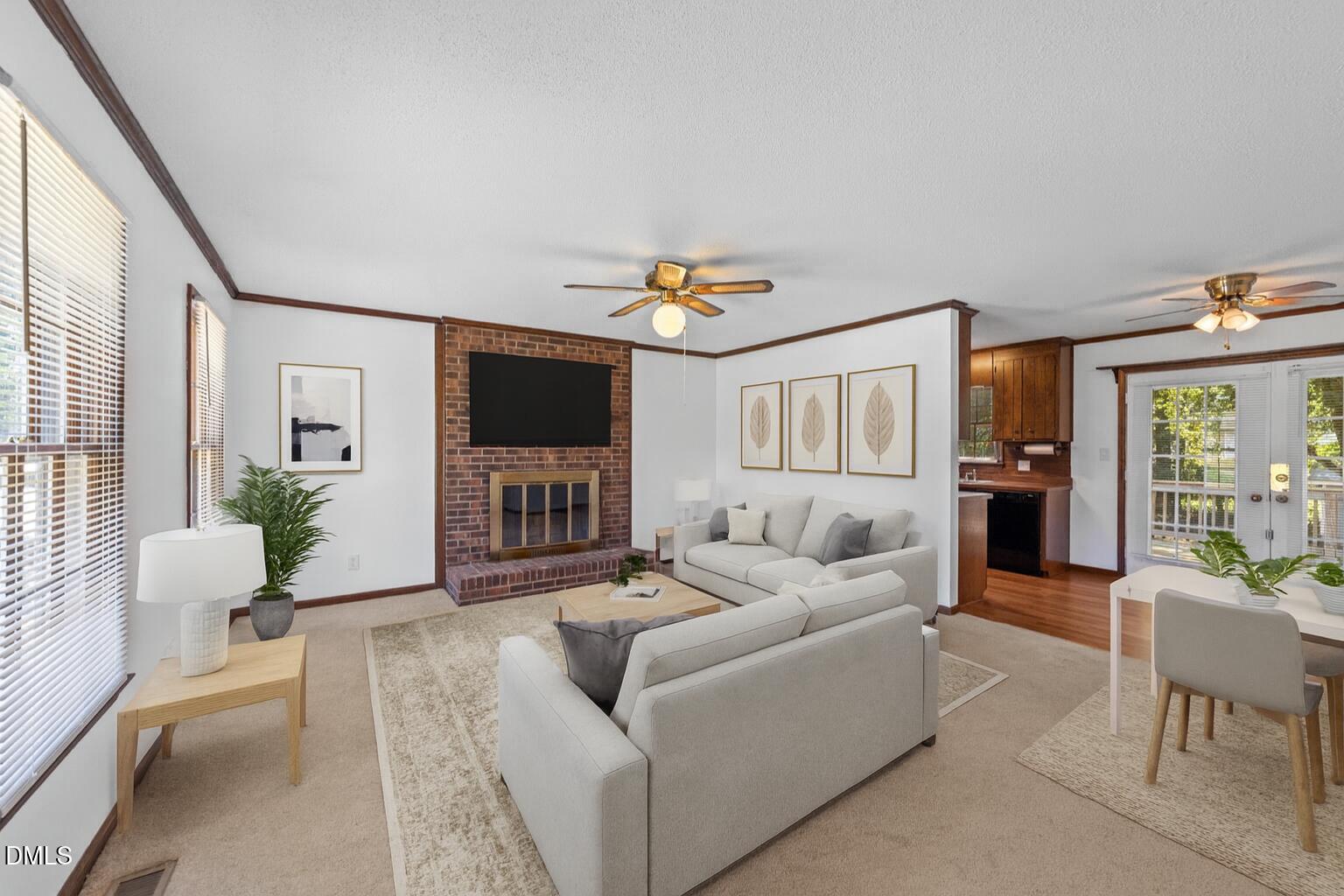 1101 Robinfield Drive Raleigh, NC 27603 - Photo 2 of 48 a living room with furniture and a flat screen tv