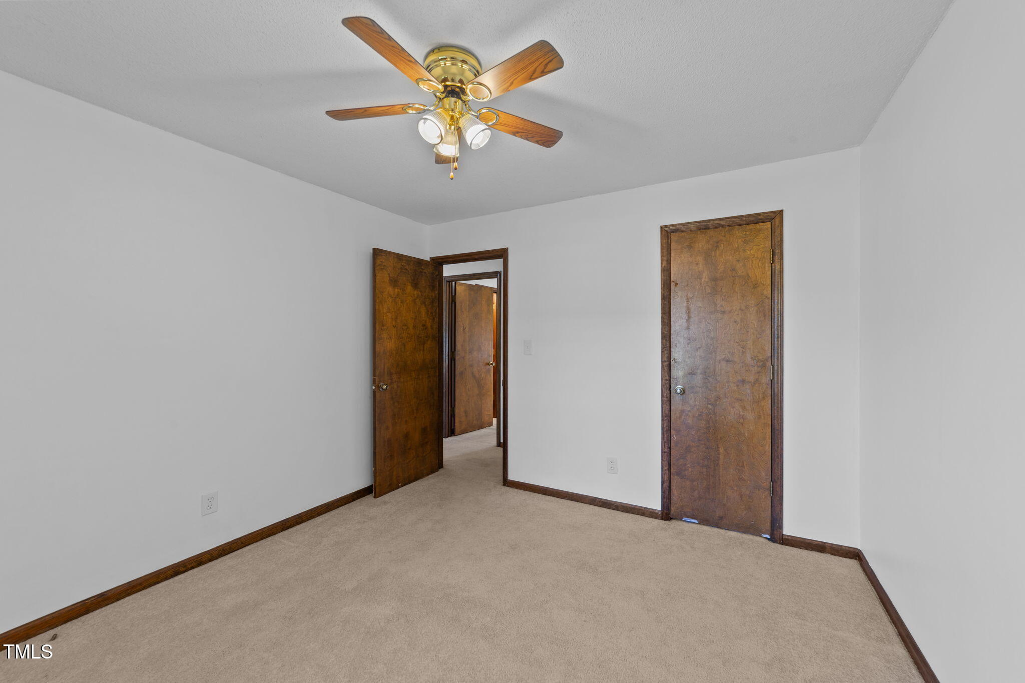 1101 Robinfield Drive Raleigh, NC 27603 - Photo 22 of 48 an empty room with a window and a ceiling fan