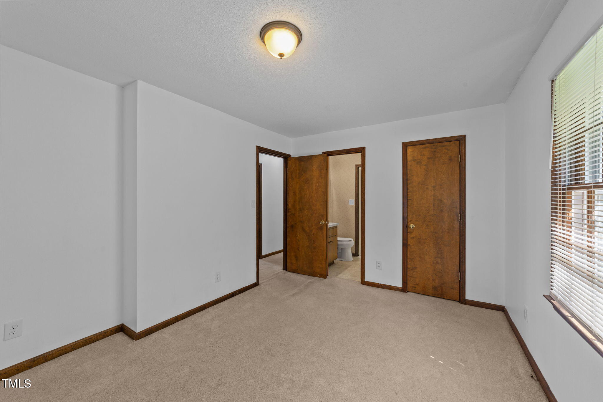 1101 Robinfield Drive Raleigh, NC 27603 - Photo 23 of 48 an empty room with windows