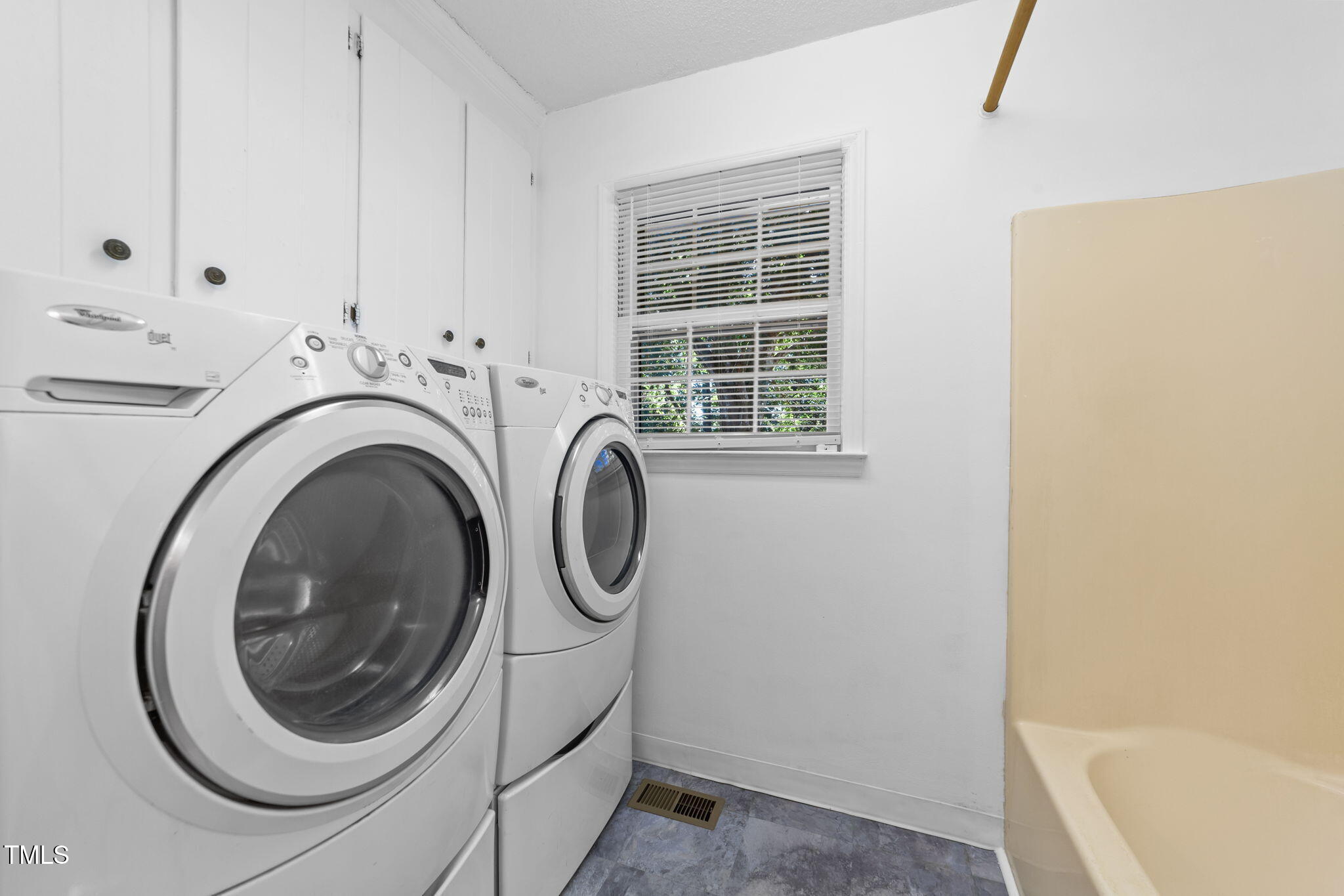 1101 Robinfield Drive Raleigh, NC 27603 - Photo 26 of 48 a utility room with dryer and washer
