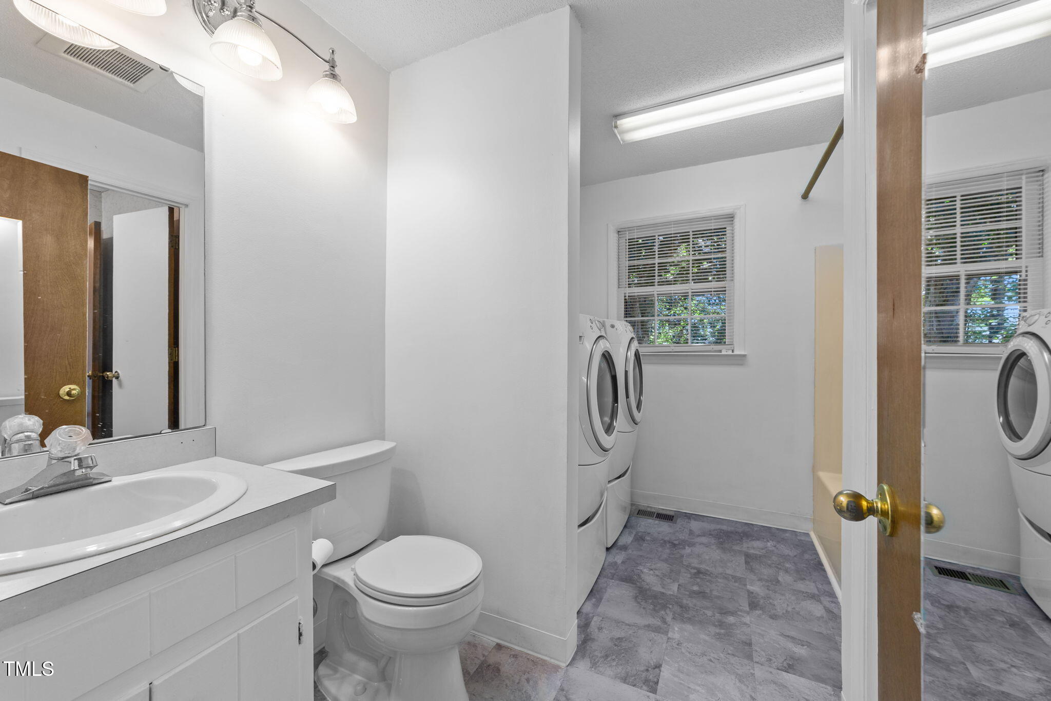 1101 Robinfield Drive Raleigh, NC 27603 - Photo 29 of 48 a bathroom with a sink toilet and shower