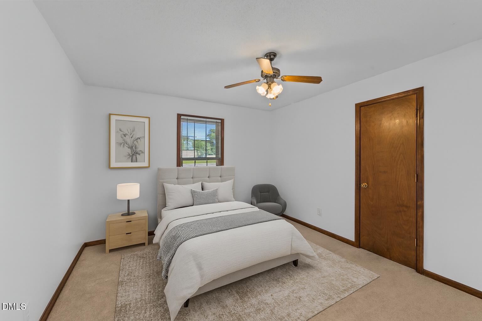 1101 Robinfield Drive Raleigh, NC 27603 - Photo 3 of 48 a bedroom with a bed and a chandelier