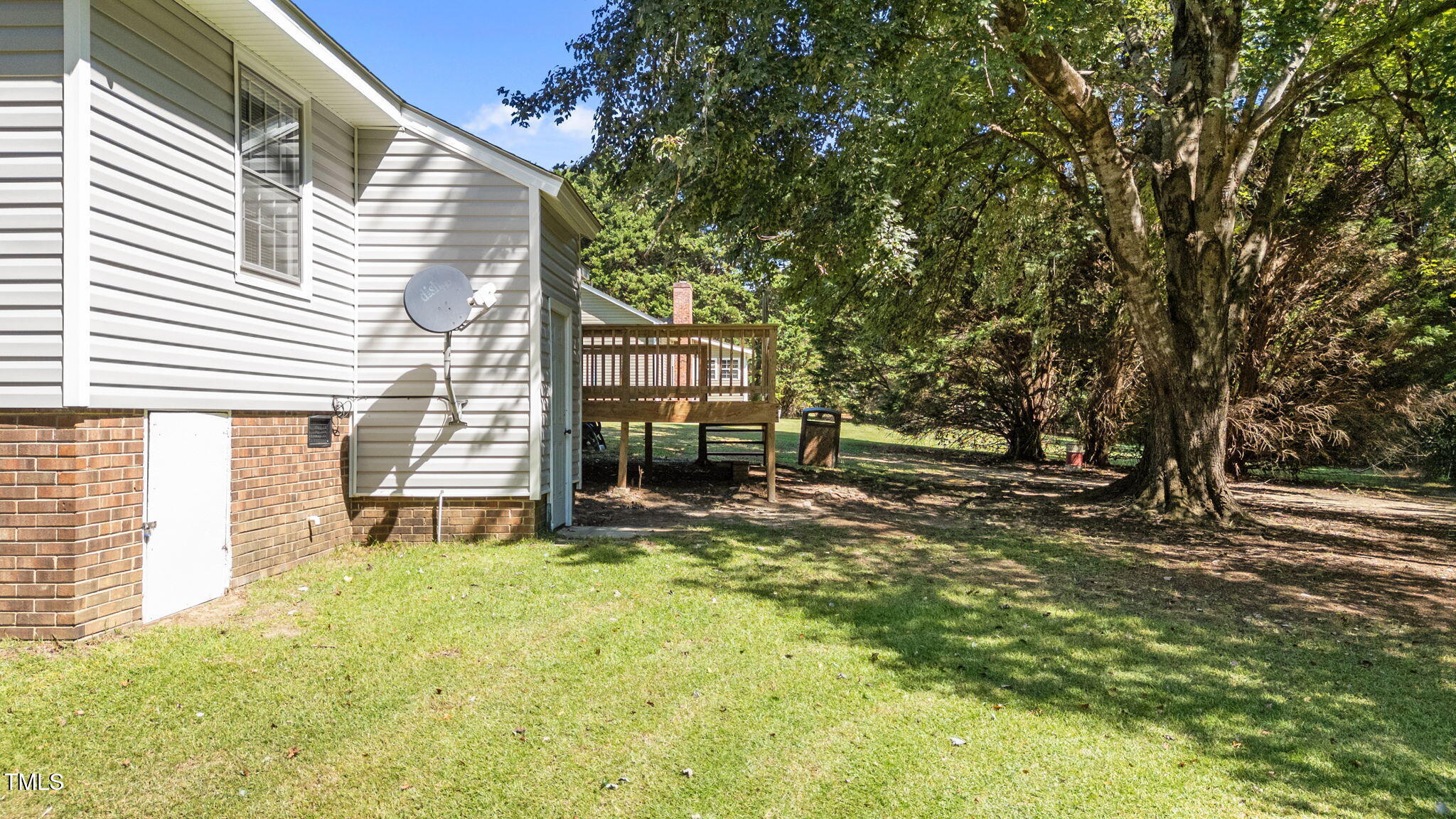 1101 Robinfield Drive Raleigh, NC 27603 - Photo 34 of 48 a view of house with backyard and trees