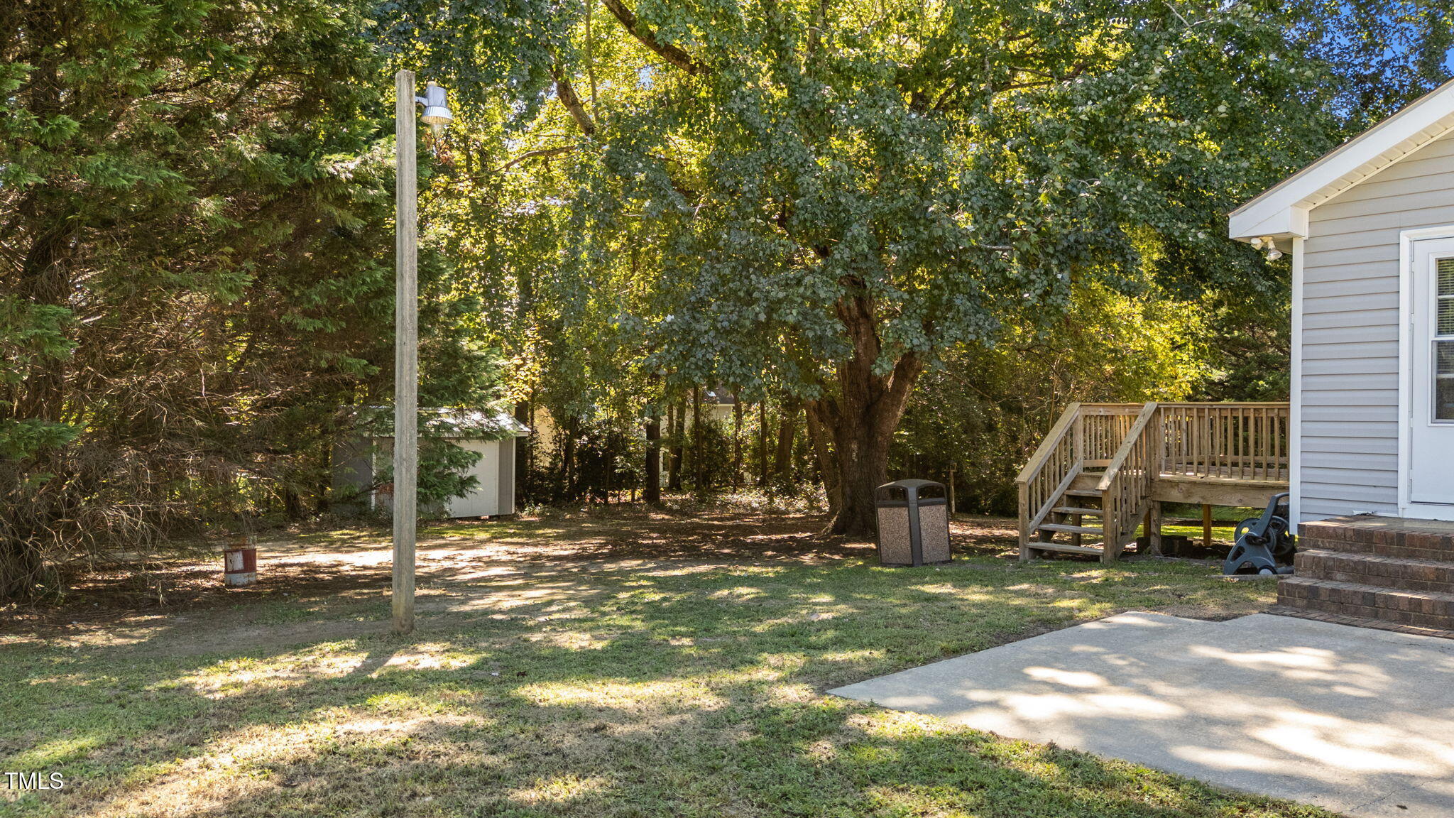 1101 Robinfield Drive Raleigh, NC 27603 - Photo 38 of 48 a view of outdoor space with deck and tree
