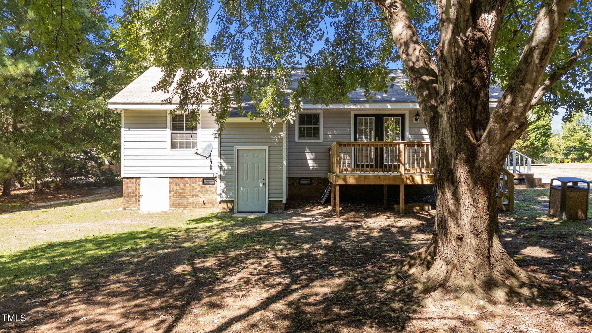 1101 Robinfield Drive Raleigh, NC 27603 - Photo 39 of 48 a front view of a house with a tree in a yard