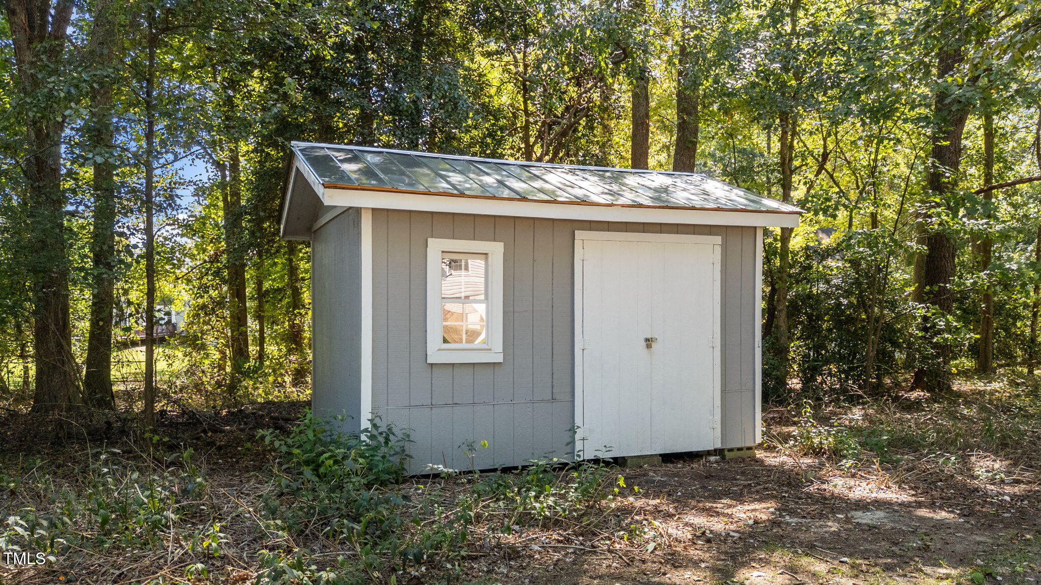 1101 Robinfield Drive Raleigh, NC 27603 - Photo 41 of 48 a view of a house with a tree