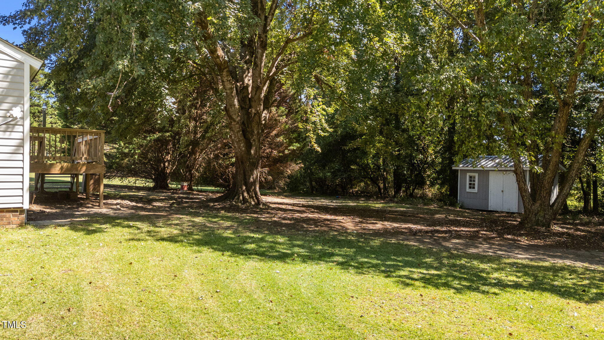 1101 Robinfield Drive Raleigh, NC 27603 - Photo 46 of 48 a view of a yard with a trees