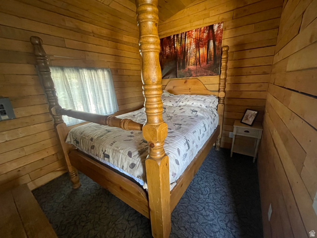 4648 West Taylor Flt Road Salina, UT 84654 - Photo 14 of 20 Interior room featuring wood-paneled walls and a window with sheer curtains