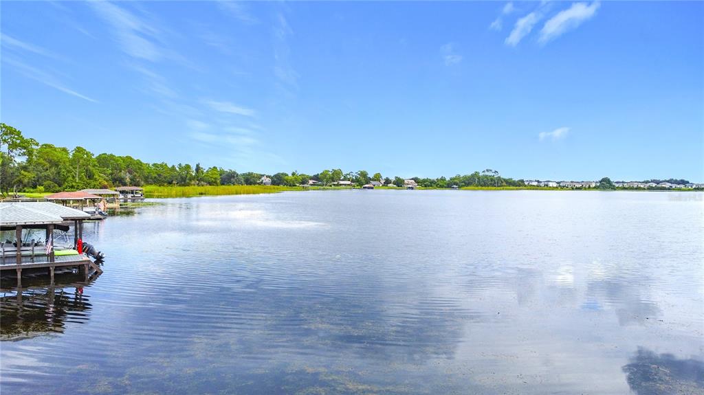 2615 Hickory Tree Road St. Cloud, FL 34771 - Photo 3 of 22 a view of outside space swimming pool and lake view