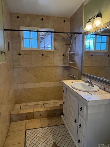 a bathroom with a sink and mirror